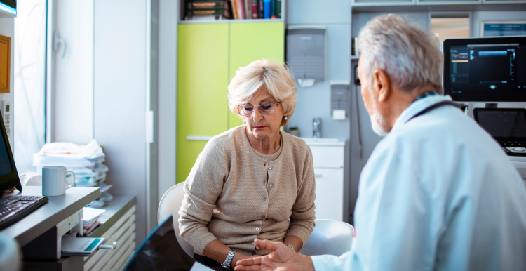 Close up of a senior woman having an appointment at the doctor's office.