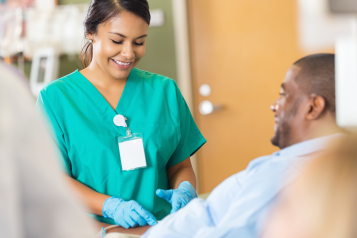 Hospital phlebotomist taking a blood sample from a patient